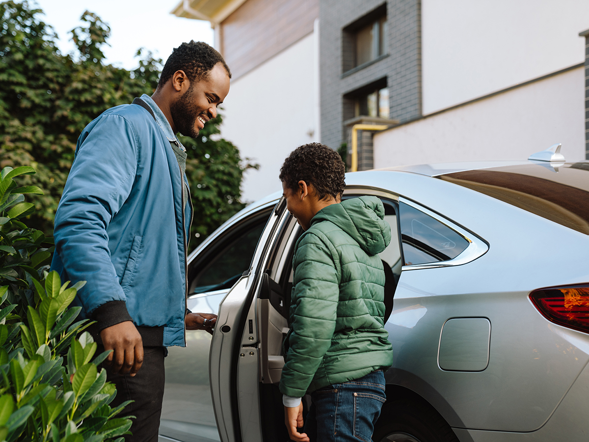 Tips and Tricks for Mice in Your Car, A Black man and his son smiling and talking together